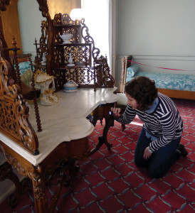 Caryne examining a dressing table attributed to the Meeks firm of New York. Stanton Hall, Natchez, MS.
