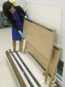 Examining the unassembled Norman Bel Geddes bed at the Brooklyn Museum’s storage room.
