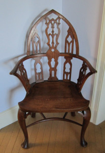 Gothic-inspired arm chair by Irving & Casson-A.H. Davenport Company. En suite with a settee, table, and umbrella stand, this chair was originally used in the Entrance Hall at Lucknow. From the collection of Castle in the Clouds.