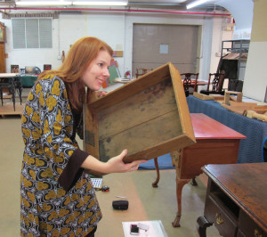Killian examining a dressing table drawer at Yale University Art Gallery.