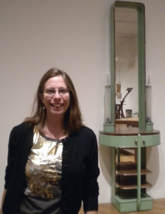 Liz in front of a night table by Kem Weber in the modern design galleries at the Minneapolis Institute of Arts.