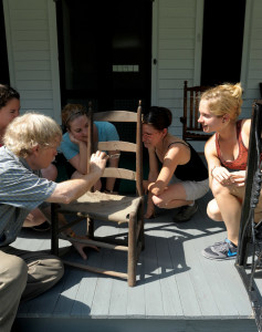 Caryne (at far left) and fellow summer 2012 field survey participants examine a chair likely made by an enslaved craftsperson with Winterthur’s Greg Landrey.