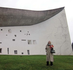Helen Scott Reed, Study Trip Abroad Leader Extraordinaire!, stands in front of Le Corbusier’s sculptural Chapelle Notre-Dame-du-Haut completed in 1954 in the hills above Ronchamp.