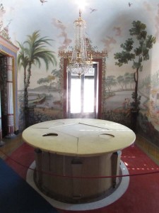 The mechanical dining table at Palermo's Casina Cinese with sections that drop down to the basement level