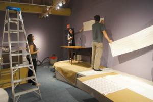 Helping to prepare OSV’s Folk Art Gallery for the Nathan Lombard exhibit by placing quotes on the walls.