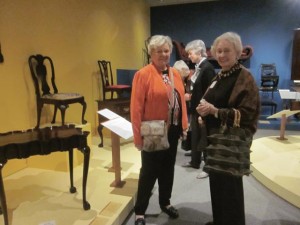 Sandra Smith and Sara White, from Houston,Texas, with Maria Thompson in the background, at the Historic Deerfield exhibit, Into the Woods: Crafting Early American Furniture.