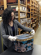 Kate Swisher measuring a bandbox as part of the collections inventory, which involves checking and updating records for OSV’s collection of around 50,000 objects.