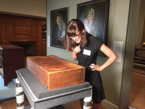 Emelie Gevalt examines the drawer from a Crossman chest at the Museum of Fine Arts Boston