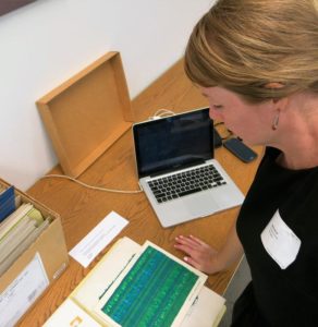 Sarah examining textile samples at the Archives of American Art
