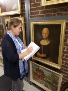 Lisa inspecting the portrait of Catharina Neisser at the Moravian Archives in Bethlehem, PA;