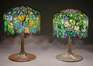 Shown on left in photo: “Grape” library lamp (genuine) Tiffany Studios, New York; ca. 1905 Leaded glass, bronze The Neustadt Collection of Tiffany Glass, Queens, New York Shown on right in photo: “Grape” library lamp (forgery) Maker unknown; 1975−2000 Leaded glass, bronze The Neustadt Collection of Tiffany Glass, Queens, New York