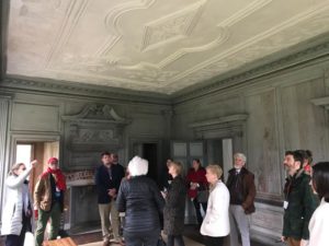 Participants examine the 18th-century plasterwork ceiling