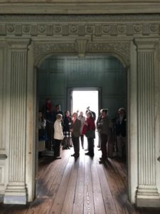 Participants examine the stair hall