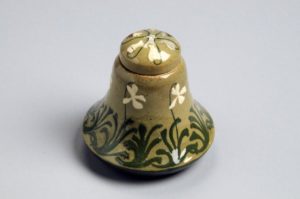 Figure 2. Inkwell with violet design decorated by Harriet Joor, c. 1897. Earthenware. Courtesy of the Newcomb Art Museum of Tulane University.