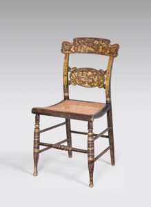 Fig. 4. Turtleback side chair, attributed to Thomas Jefferson Gildersleeve (1805–1871), New York City, 1827–1835, paint and bronze powder stenciling on wood with cane seat. American Folk Art Museum,  New York. Gift of Helaine and Burton M. Fendelman, 2017.21.1. Photo by Gavin Ashworth.