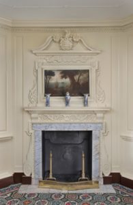 Fig. 2. The mantel and overmantel feature “a neat landscape” painting and carved coat-of-arms George Washington purchased from London in 1757.