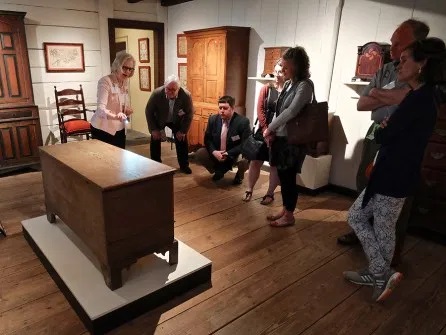 The full-access tours of MESDA were a particular highlight of the symposium. Here June Lucas discusses North Carolina furniture.