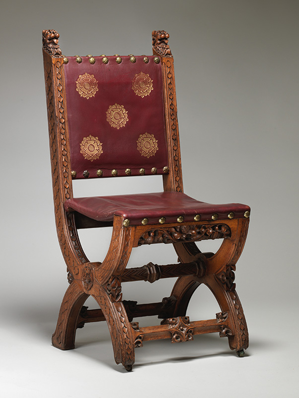 Figure 8. Augustus Welby Northmore Pugin, Made by Holland & Sons, Dining chair, 1859. Carved oak, gold-stamped leather; metal casters. Gift of Irwin Untermyer, by exchange, 2015 (2015.638).