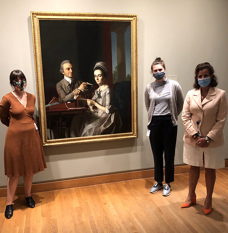 Curatorial staff stands in front of a recently conserved Copley, Portrait of Mr. and Mrs. Thomas Mifflin (Sarah Morris).
