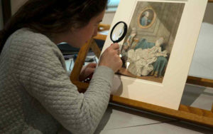 Margot Bernstein, a PhD candidate at Columbia University, examines a Carmontelle portrait at the Cleveland Museum of Art.
