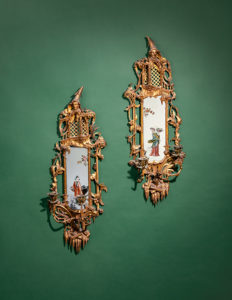 A Pair of Chinese Chippendale Giltwood and Reverse-Painted Glass Mirrors. 18th Century. 36 x 13 in. Property from the Estate of Joseph E. Suiter, Columbus, Ohio. Estimate: $3,000–$5,000.