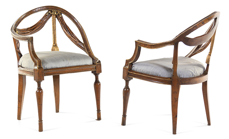 A Pair of Italian Parcel Gilt Walnut Armchairs. Late 18th/Early 19th Century. Height 31 in. Estimate: $800–$1,200.