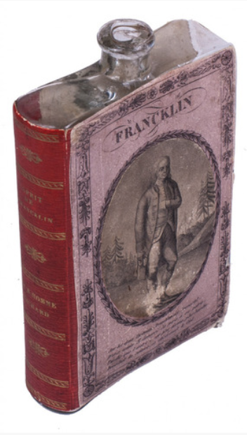 Glass book flask also created by the Fremy Brothers that features a print of Benjamin Franklin and the title, ‘Esprit de Franklin.’ Courtesy of Rare Book Forum.