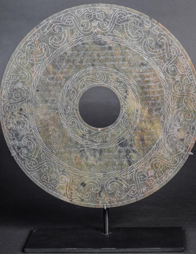 Bi Disk with Imperial Decoration, Western Han Dynasty, 206 BCE -12 CE, Chinese. Jade. Gift of Genevieve and Richard Shaw, by exchange, FIA 2010.284.