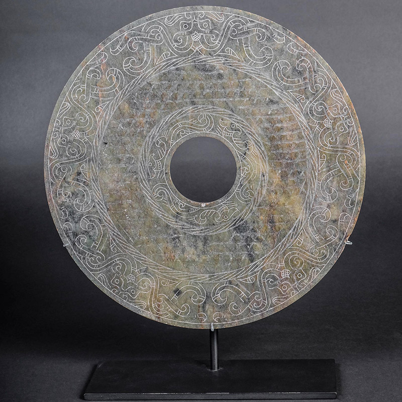 Bi Disk with Imperial Decoration, Western Han Dynasty, 206 BCE -12 CE, Chinese. Jade. Gift of Genevieve and Richard Shaw, by exchange, FIA 2010.284.