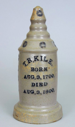 Figure 4. Charles Frederick Decker, Salesman’s Sample Ceramic Grave Marker, circa 1872 – 1906, salt glazed stoneware with cobalt lettering and decoration. Image via www.crockerfarm.com