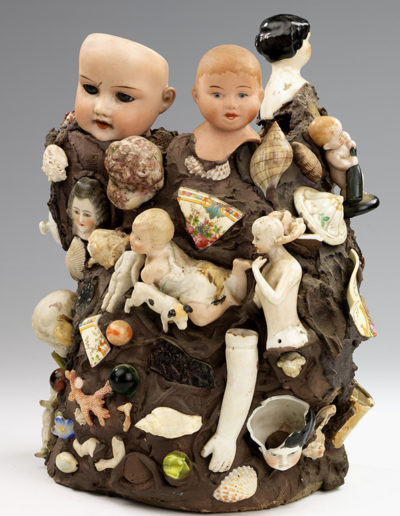 Figure 5. Anonymous, Memory Vessel with Doll Parts, n.d., sewer pipe clay overlaid with applied brown compound, 11 5/8 x 9 1/8 x 8 in. Smithsonian American Art Museum: Luce Center, Gift of Herbert Waide Hemphill, Jr., 1998.84.67.