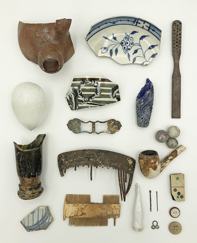 Cover image: An artifact assemblage excavated from the Chancognie House. Artifacts range from late-18th-century delftware to a late-19th-century porcelain doll arm.