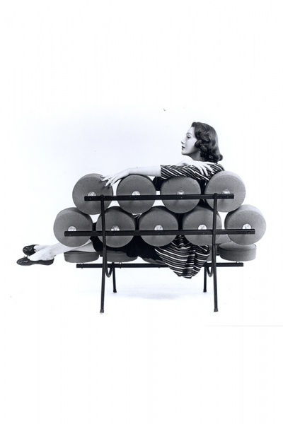 Hilda Longinotti, of the George Nelson Office, posing on a Marshmallow Sofa, c. 1956. Courtesy of Herman Miller Archives.