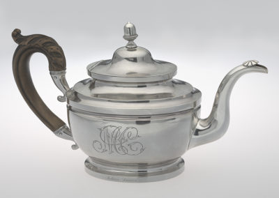 Peter Bentzon, Teapot, 1817-1829, Philadelphia, PA. Silver, wood. Smithsonian National Museum of African American History and Culture, 2010.14. Born in the early 1780s in the West Indies, Peter Bentzon was a free man of color. He apprenticed as a silversmith in Philadelphia and then traveled to St. Croix where he opened his own silver shop. In 1817, Bentzon returned to Philadelphia and opened a silver shop.