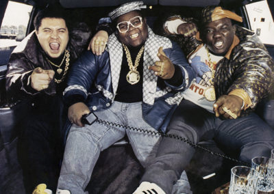 Figure 3. Brooklyn hip hop trio the Fat Boys wearing Dapper Dan custom leather jackets and caps, 1987. Photo: Steve Friedman © 2020.