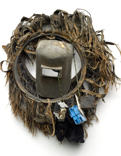 Figure 3: African Mask, Lonnie Holley, 2004. Automobile tires, welder's mask, electrical outlets, electrical cord, door lock, lace fabric. Collection of the Metropolitan Museum of Art. Image by Steven Pitkin/Pitkin Studios. Courtesy of Souls Grown Deep Foundation.