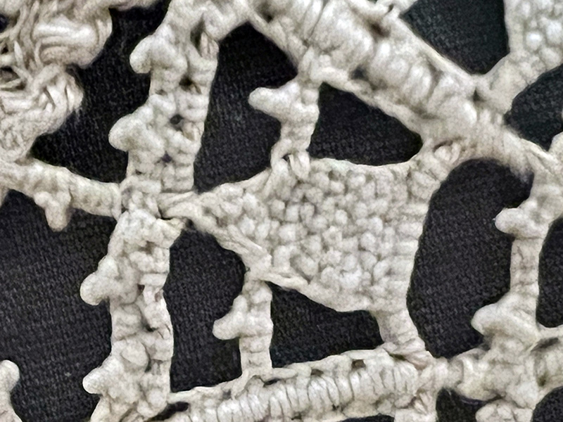 Figure 2. Detail, unknown makers, cover, 1575–1600, Venice, Italy. Linen, cutwork and needle lace. Cleveland Museum of Art, Gift of Mrs. Edward S Harkness in memory of Mrs. Stephen V. Harkness, 1930.656. Photo by author.