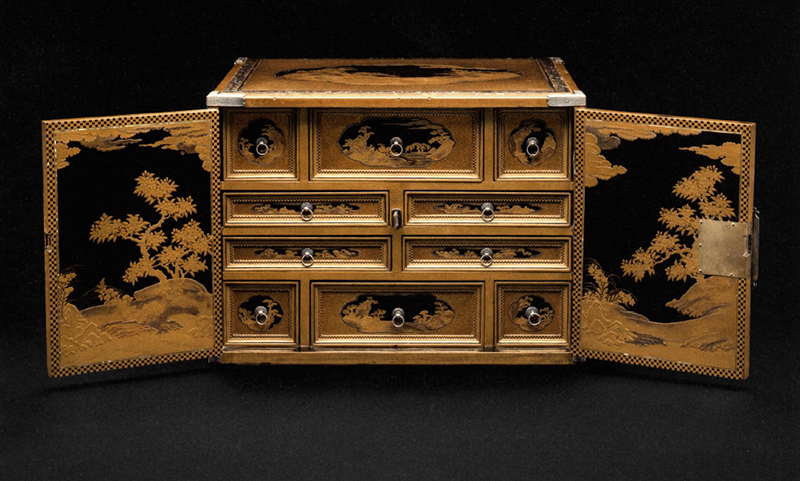 Figure 3. Cabinet, c. 1640s Japan. Wood covered in black and red lacquer, with mother of pearl, gold and silver takamaki-e, hiramaki-e and nashiji lacquer, and silver mounts. Peabody Essex Museum, AE85343. Photo from Karina Corrigan et al., Asia in Amsterdam, cat. 39.