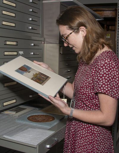 Mary Orms examines a work on paper in the Historic Deerfield conservation lab.
