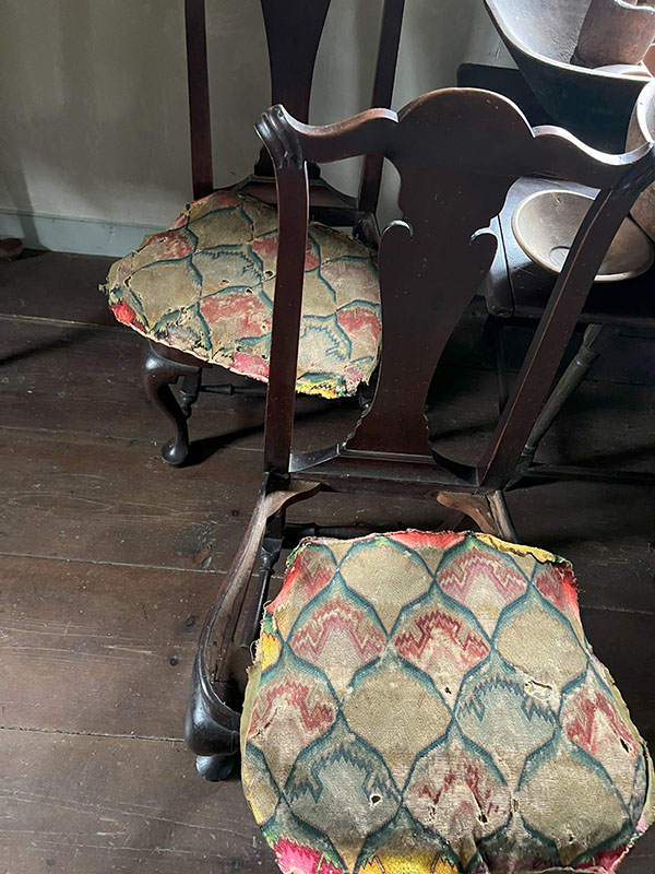 Figure 5. Mary Ballantine Ashley’s dowry chairs in the Ashley House’s North Parlor with her recently discovered original embroidery laid atop: Unknown maker, Side chairs, 1755–66, Massachusetts. Maple. The Trustees of Reservations, AH.787.1, AH.787.2; Mary Ballantine Ashley, Cover for a chair seat, 1760–69, Westfield or Sheffield, MA. Canvas and wool. The Trustees of Reservations, Gift of Gelston Hardy, AH.F.35.a, & AH.F.35.b. Image courtesy of The Trustees of Reservations.