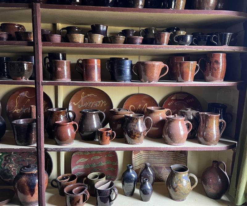 Figure 7. Redware collection in the Ashley House’s Buttery. Image courtesy of The Trustees of Reservations.