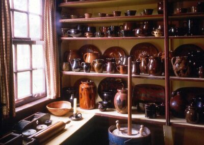 View of the Ashley House buttery with display of redware.