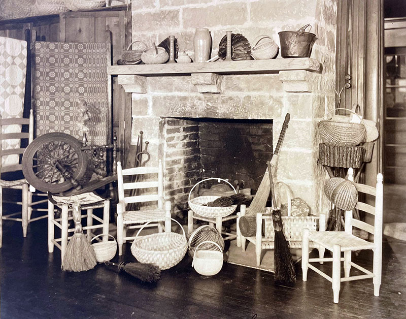 Figure 1. The hearth at the Log Palace at Berea, the retail hub for Berea Student Craft, c. 1918. This image shows items available for purchase from Fireside Industries either in person or by mail-order catalog. (The baskets were not made at Berea but were sourced from the Mammoth Cave area from local families.) Image courtesy of Berea College Special Collections and Archives.