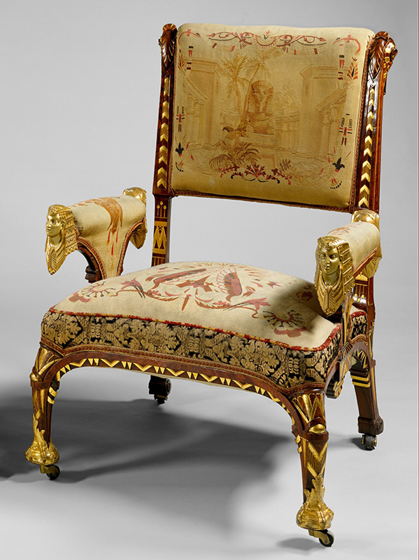 Figure 3. Attributed to Pottier & Stymus Manufacturing Company, Armchair, 1870–75, New York, NY. Rosewood, prickly juniper veneer, gilding, brass, original tapestry upholstery. The Metropolitan Museum of Art, Funds from various donors, 1970, 1970.35.1.