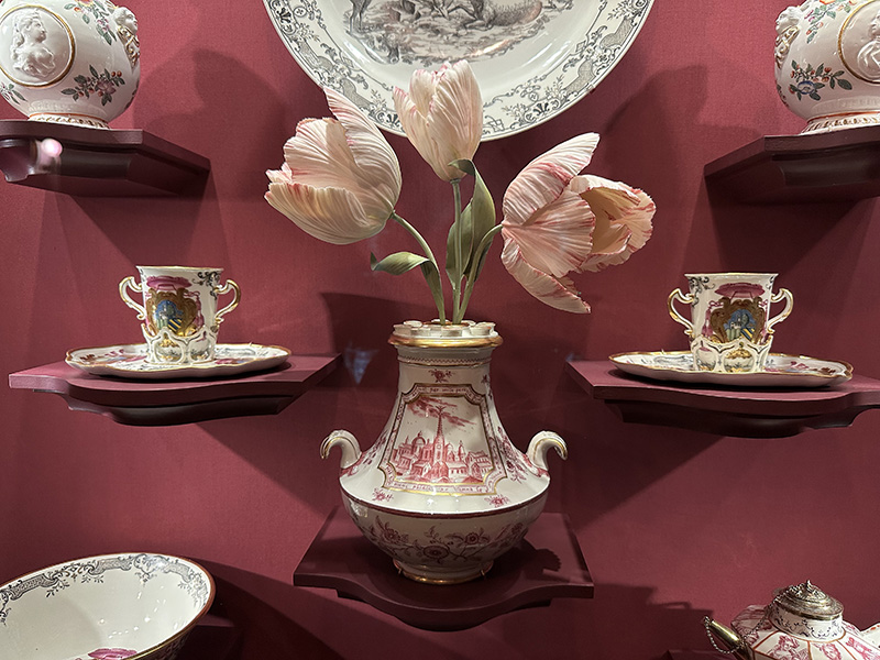 Tulip vase, 1725, Du Paquier Porcelain Manufactory, Austria. Hard-paste porcelain. The Frick Collection, gift from the Melinda and Paul Sullivan Collection, 2016, 2016.9.12. Vladimir Kanevsky, Tulip stems, 2024–25, Fort Lee, New Jersey. Soft-paste porcelain, glazes, overglaze, and copper.