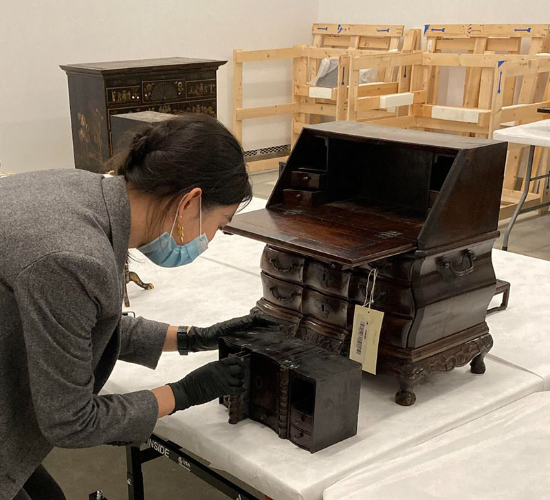 Figure 4. Examining a Chinese export miniature hardwood desk at the Peabody Essex Museum.