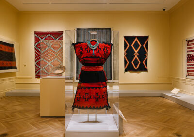 Figure 1. Installation view showing a Diné biil éé' (woman's rug dress).