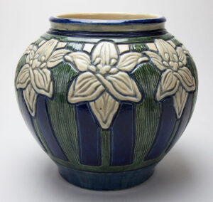 Newcomb College Pottery; Leona Fischer Nicholson (1875–1966), decorator; Joseph Fortune Meyer (1848–1931), potter; Vase with day lily design, 1904. Earthenware with underglaze polychrome ornament. Newcomb Art Museum, 1982.419-C.