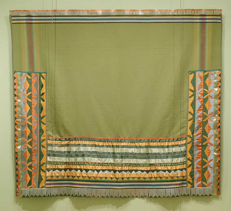 Figure 4. Laura Watters Maynor (Lenape, Delaware Tribe of Indians, Wolf Clan), ‘𝘚𝘪̀𝘭𝘬𝘩𝘢𝘴𝘪𝘬 𝘈𝘩𝘬𝘸𝘪𝘺𝘢̀𝘯 (𝘏𝘰𝘯𝘰𝘳 𝘉𝘭𝘢𝘯𝘬𝘦𝘵), 2023, Oklahoma. Wool, satin ribbon. Collection of Jeremy Johnson on loan to the Philadelphia Museum of Art. Photo by Aimee Almstead.