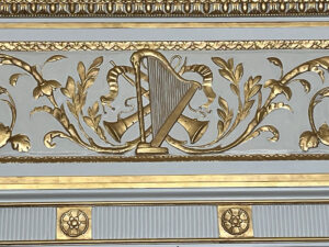 Figure 2. Detail of plaster work above the doorway in the Music Room. Image courtesy of Nemours Estate.